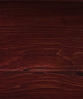 Premium One Coat Wood Stain Sealer For Log Homes In Black Canyon Red finish on smooth wooden surface, showing rich red tones.