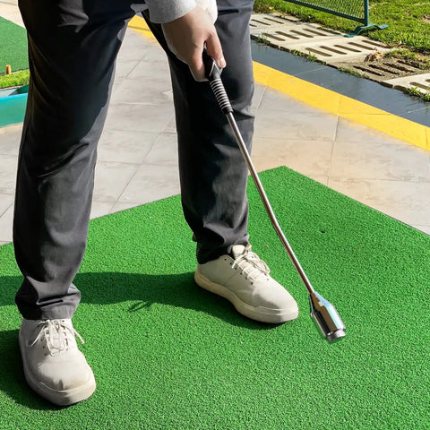 Golfer using Dope Golf Swing Trainer Aid for right handed players with non slip rubber handle and adjustable head for smoother swing.