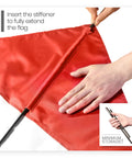 Hands inserting stiffening pole into Diver Down Warning Flag With Removable Stiffening Pole 20 By 24 Inch Red And White Diving Flag