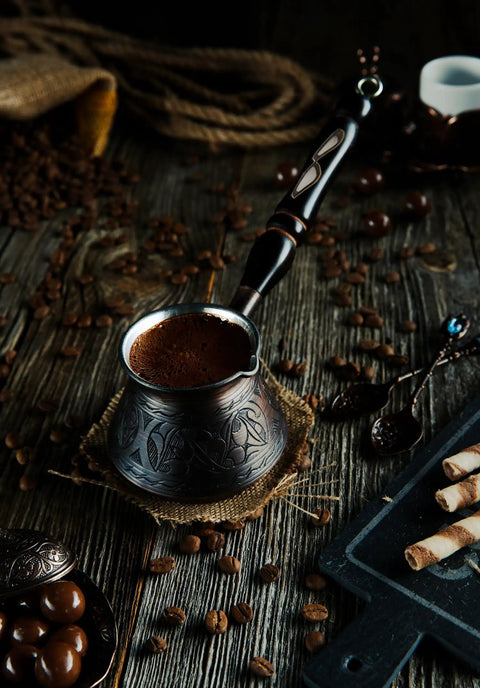 Thick Copper Turkish Coffee Pot Cezve Ibrik Briki With Wooden Handle And Hand Engraving Antique Copper Finish on rustic table
