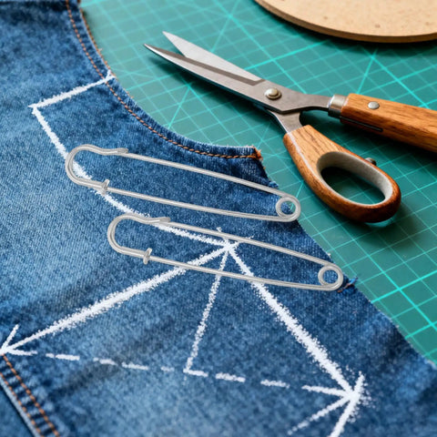 Heavy Duty Safety Pins Set By Adorainbow on denim fabric, with scissors nearby, perfect for DIY crafts and secure fastening.