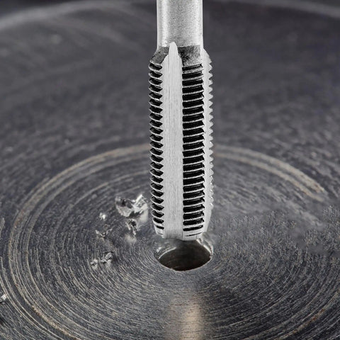Close-up of tap cutting thread into metal using Heavy Duty 80 Piece Tap And Die Set With SAE And Metric Threads In 52100 Bearing Steel CNC Machined