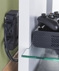 Six Swivel Outlet Surge Protector With 1200J Surge Protection behind a shelf with a console controller on top
