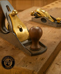 Slick Low Angle Shoulder And Chisel Plane Built For Dead On Edge And End Grain Trimming Boasts An Adjustable Mouth Precision Tuned Steel Blade Plus Includes A Rugged Storage Case, displayed on wooden workbench.