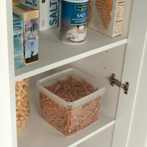Inside view of Slim Pantry Cabinet With Adjustable Shelves, showcasing dry goods on white shelves.