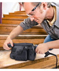 Man using 600W Electric Belt Sander With Variable Speed Control And Copper Motor on wooden stairs for woodworking projects.
