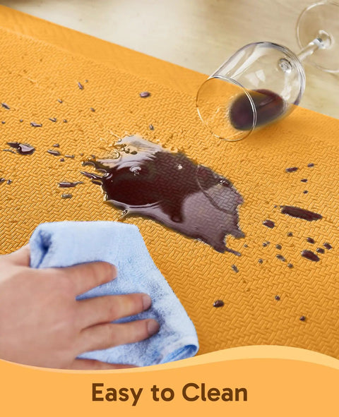 Spilled wine on Anti Fatigue Kitchen Mat Cushioned 0.75 Inch Thick Standing Pad For Kitchen Office And Sink 20 By 32 Inches Waterproof Ergonomic Comfort Non Slip Bottom Bright Orange Easy To Clean, hand wiping with cloth.