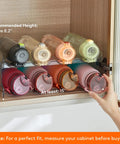 Totally Game Changer Stackable Water Bottle Organizer For Cabinet Storage, Clear Tumbler Holder That Takes 32 Oz Bottles And Energy Drinks, showing bottles stacked in organizer.