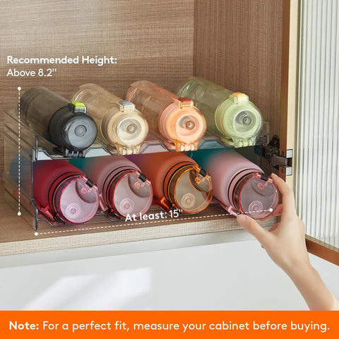Totally Game Changer Stackable Water Bottle Organizer For Cabinet Storage, Clear Tumbler Holder That Takes 32 Oz Bottles And Energy Drinks, showing bottles stacked in organizer.