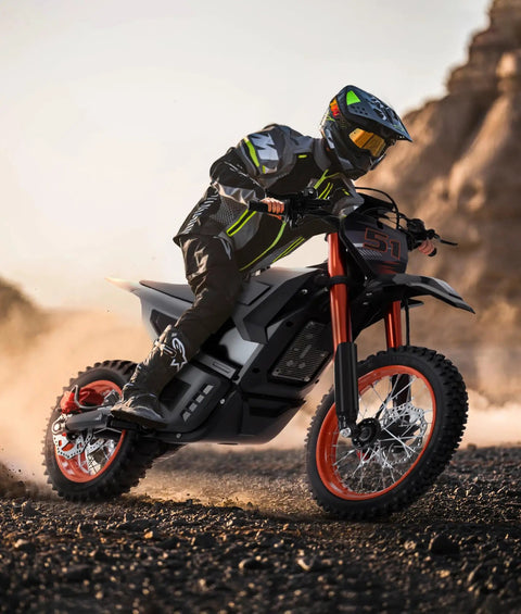 Rider on Teens Electric Dirt Bike 2000W Peak Power Off Road Monster with 48V 20Ah Battery in rugged terrain, orange accents.