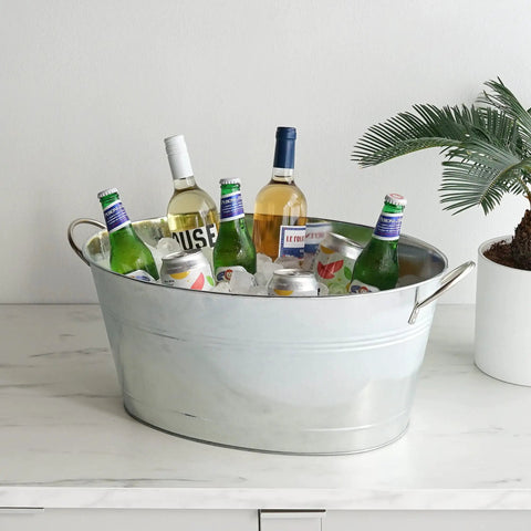 Large Galvanized Ice Tub For Parties With Sturdy Handles Six Point Three Gallon Beverage Cooler For Beer Wine Soda And Bottled Water Rustic Indoor Outdoor Drink Bucket For Tailgates BBQs And Backyard Gatherings filled with ice and various drinks