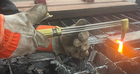 Beefed Up Medium Duty Hand Torch For Industrial Cutting And Welding With Interchangeable Tips in action, showing flame on metal