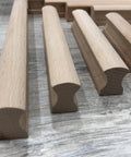 Six Unfinished Beech Wood Furniture Pull Handles Set For Cabinets And Drawers, array of unpainted wooden pulls on wood surface