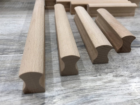 Six Unfinished Beech Wood Furniture Pull Handles Set For Cabinets And Drawers, array of unpainted wooden pulls on wood surface