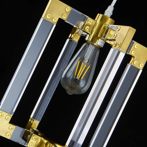 Gold Pendant Light Fixture With Brushed Brass Finish and acrylic frame with visible bulb inside