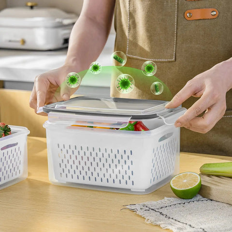 Person opening a 5 Pack Large Fridge Storage Containers With Removable Colander, Leakproof Design, Dishwasher And Microwave Safe, Keeps Fruits, Vegetables, Berries And Meats Fresh Longer