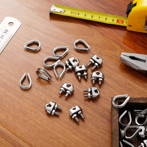 40 Piece One Eighth Inch Wire Cable Clamps Kit With M3 Rope Clips And Stainless Steel Thimbles on wooden surface