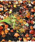 Dope Garden Rake Hand Tool With Tough Tines For Loosening Soil And Cultivating Flowers And Plants Lightweight Gardening Supply For Lawn Maintenance Ideal For Weeding Dethatching And Easy Garden Care, green steel leaf rake on wet soil
