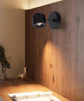 2 Packs Modern Adjustable Black LED Wall Sconce Lights With Rotating Angle 3000K Warm White 7W High CRI 97 Perfect For Hallway Gallery Display Bedside Bedroom Accent mounted on wood panel wall above desk.