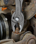 8 Inch Pliers With Front And Side Gripping in action on a rusted nut, showcasing front jaw gripping stripped screws in tight spaces