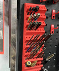 45 Degree Angled Hex Bit Organizer With 21 Hole Drill Bit Holder mounted on a pegboard, holding various drill bits securely.