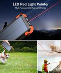 LED red light pointer feature on Solar Charger Power Bank With Built In Cables And 42800mAh Battery, in use outdoors and with pets
