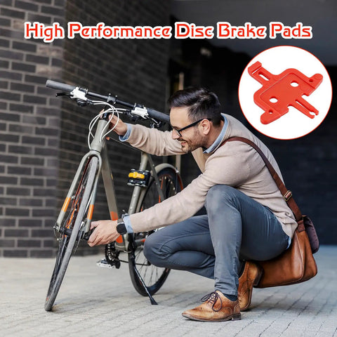 Man adjusting bike wheel with 4 Piece Bicycle Brake Spacer Set For Disc Brakes And Hydraulic Systems, Lightweight Plastic Spacers inset.