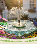 Go To Solar Water Pump Fountain For Garden Bird Bath With Built In 1500mAh Battery 3.5W Panel And 8 Nozzles High Efficiency Glass Panels Outdoor Pond Pool Fish Tank Dark Green in bird bath surrounded by flowers.