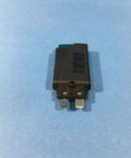 Hella Tough Thermal Miniature Circuit Breaker With Plug In Screw Fuse Terminal Block For 2 Amp 250V AC And 65V DC Panel Applications  front view on blue background.
