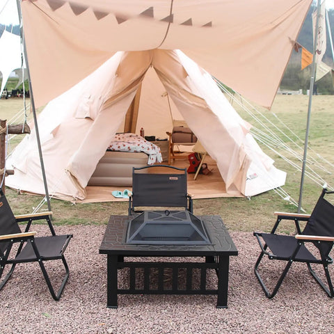 Camping scene with 32 Inch Square Fire Pit Table With Spark Screen, Fire Poker, And Ice Bucket Cooler, chairs, and tent