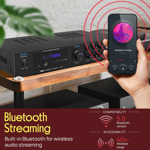 Bluetooth 5.1 Home Theater And Karaoke Amplifier That Delivers Party Ready Big Room Sound With Five Channels And Subwoofer Output Two Mic Inputs With Echo USB A Plus SD MP3 Player RCA In PDA8BU on shelf with phone showing music streaming.