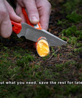 Fast Fire Stick Survival Fire Starter Tinder Upgrade being cut on ground with knife for emergency campfire, bushcraft, hiking.