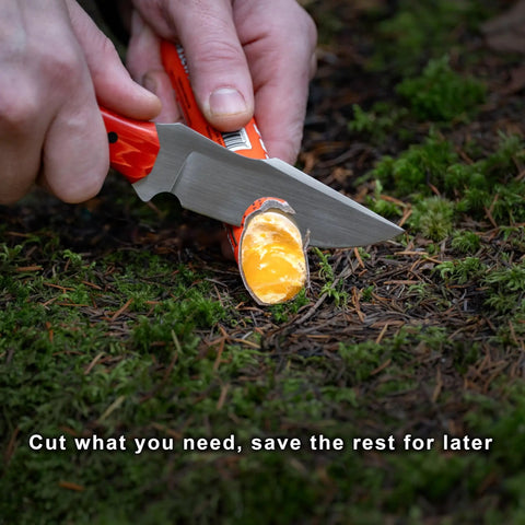 Fast Fire Stick Survival Fire Starter Tinder Upgrade being cut on ground with knife for emergency campfire, bushcraft, hiking.