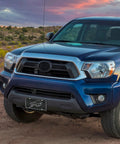 NFL Buffalo Bills Carbon Fiber Metal Auto Tag Paired With Official Vinyl Decals For Your Rig To Flex Big Team Pride and crisp graphics on a blue truck.
