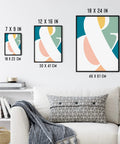 Modern abstract art in three black frames, displayed in sizes 7x9, 12x16, and 18x24 inches on a living room wall above a couch.