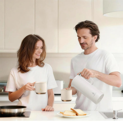 Real Deal Thermal Coffee Carafe Holds Fifty Ounces Advanced Vacuum Insulated Stainless Steel Beverage Dispenser in kitchen with couple.