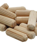 Upgrade Your Woodworking Projects With These Half Inch Hardwood Dowels That Nail Perfect Joinery Featuring Smooth Chamfered Tips And Deep Flutes For Superior Water Based Glue Absorption That Expands Into Rock Solid Bonds. Fluted hardwood dowels in a pile, 1/2 inch size.