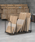 Beefy Carton Stand With Wheels Heavy Duty 500Lb Cardboard Box Storage Rack Rolling Carton Organizer in use in a warehouse.