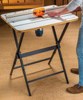 Rock Solid Router Table Kit With Powder Coated Steel Stand And Smooth Phenolic Plate crafted for precision routing in a workspace.