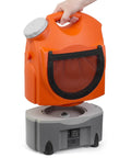 Person lifting detachable tank from On The Go Portable Spray Washer With Built In Water Tank, Rechargeable Battery Or Car Or Home Plug