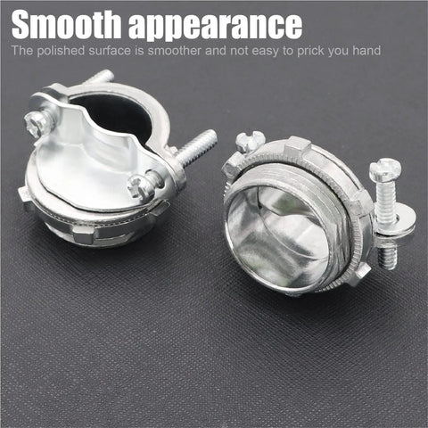 Two silver zinc NM clamp type cable connectors for metallic conduit shown from front and side view on black surface