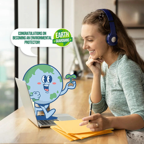 Woman smiling at laptop with cartoon Earth character, stack of Yellow Kraft Padded Bubble Mailer 6x10 Inch Pack Of 100 on desk.