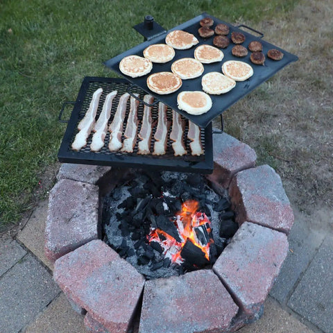 Open Flame Campfire Grill And Skillet Combo For Outdoor Cooking over backyard fire pit with food grilling