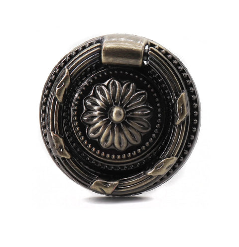 Close-up of a zinc alloy bronze-tone ring pull from 8 Pack Vintage Ring Pulls In Bronze Tone 37mm Diameter European Style Cabinet Dresser Drawer Hardware With 4mm Screws Antique Zinc Alloy Knobs For Furniture Like Cabinets Chests Wardrobes And Bookshelves, featuring an ornate floral design.