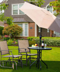 Outdoor Glider Chairs Set Of 2 With Sturdy Metal Frame And Breathable Mesh next to table on lawn with umbrella
