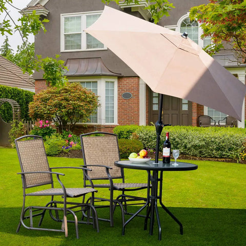 Outdoor Glider Chairs Set Of 2 With Sturdy Metal Frame And Breathable Mesh next to table on lawn with umbrella