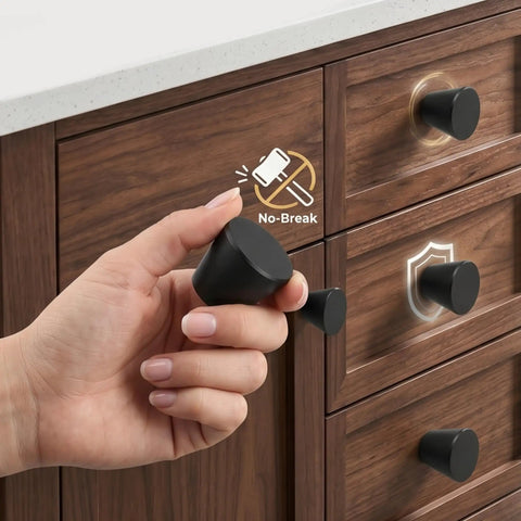 Hand holding Built Tough Black Round Cabinet Knobs Package Of Six Heavy Duty Aluminum Dresser Handles for drawers