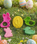 Front view of Joyin 44-piece clay tools set: pink bunny, yellow chick-in-egg mold, green duck cutters on grass