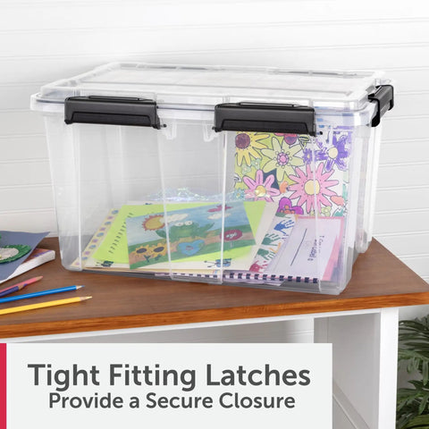 54 Quart Tough As Nails Crystal Clear Storage Tote With IP68 Rated Gasket Sealed Lid and Heavy Duty Secure Latches holding colorful papers.
