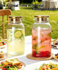 Two Piece Glass Pitcher Set Including Secure Glass Lid And Cushioned Anti Slip Silicone Base For Kitchen Counter Safe Serving with iced drinks.